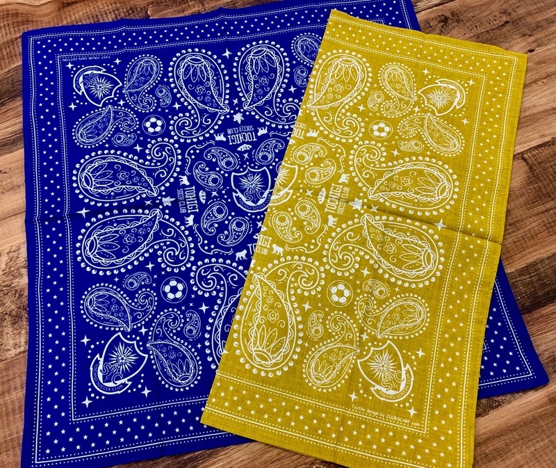 【バンダナ】
・NEWデザイン・カラーのバンダナが登場！今回はこれまでの鮮やかなイエローではなく、上品でクラシックなマスタードとネイビーの2色。
よーく見てみてください、栃木らしさが詰め込んであるデザインです！
■価格：1,080円
■サイズ：53×53センチ
■素材：綿100％
■原産国：Made in japan
■販売場所：ファンエリア内グッズ売店、ホームゴール裏グッズ売店